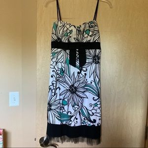 Medium white and black floral women’s dress with teal accents